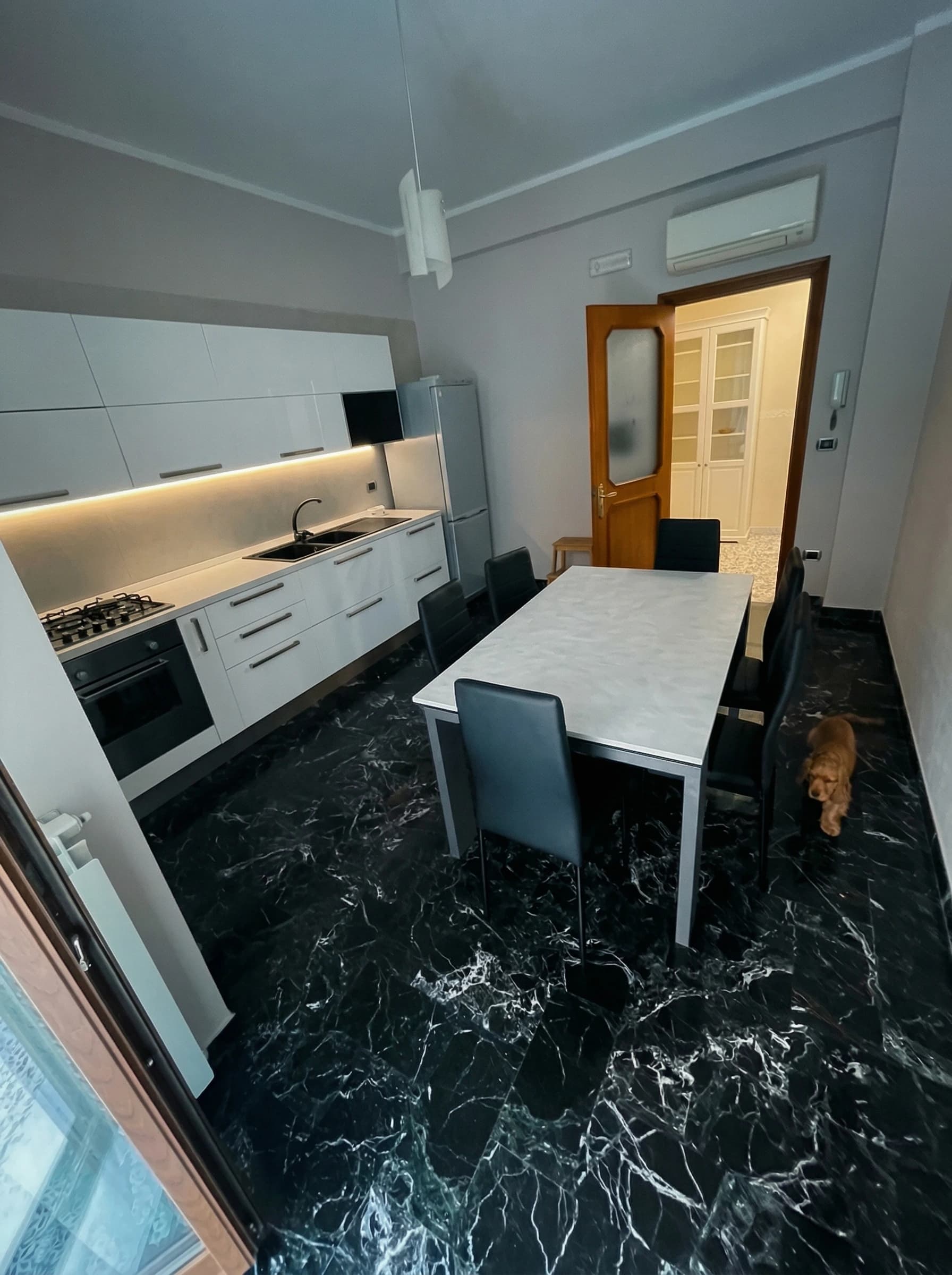 Kitchen dining area with marble floor